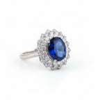 Delicate oval 3A zircon ring in rhodium by Bound Jewels, showcasing intricate design and sparkling gemstone details.