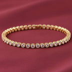 Classic round zircon tennis bracelet by Bound Jewels, featuring sparkling stones set in a sleek metal chain design.