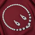Rhodium necklace and earring set featuring zircon stones in a delicate wreath design by Bound Jewels.
