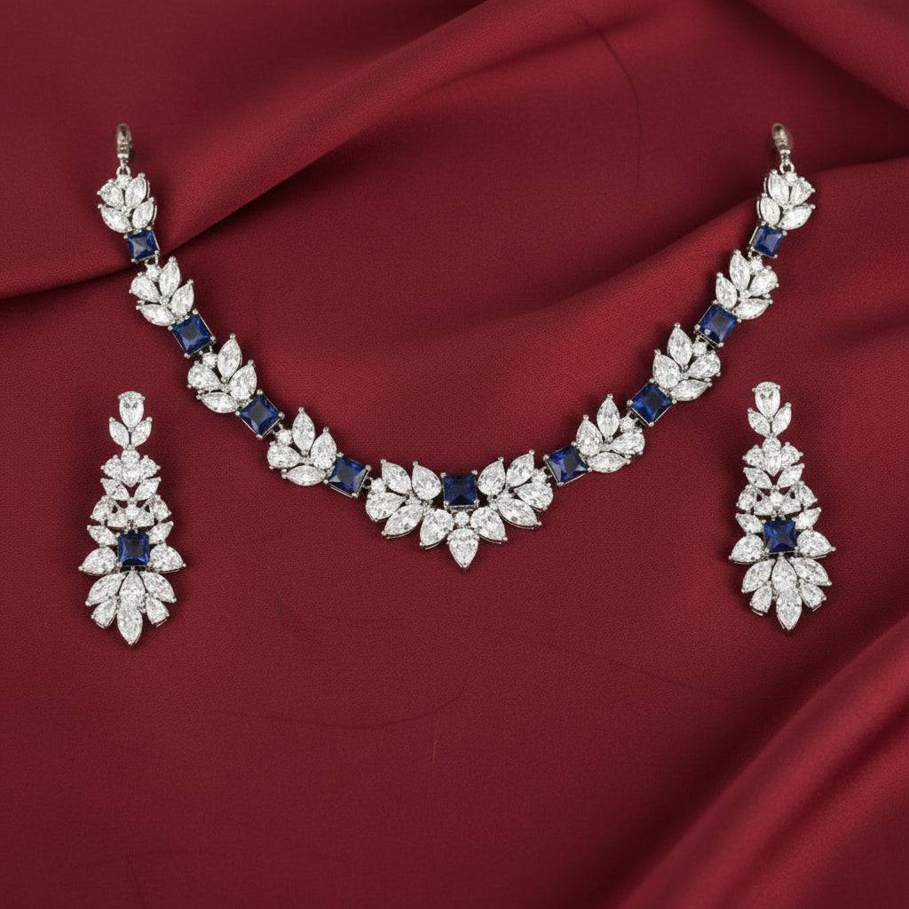 Rhodium necklace and earring set featuring a wreath design with zircon stones by Bound Jewels.