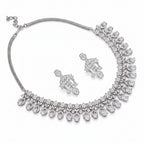 Bound Jewels floral petal zircon choker and drop earrings set in rhodium, showcasing intricate designs and sparkling details.