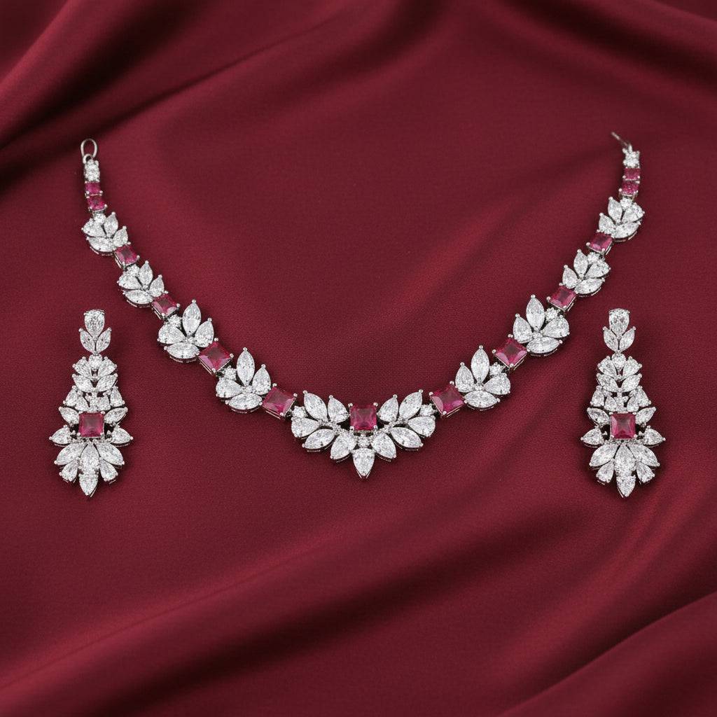 Rhodium-plated necklace and earring set featuring zircon stones, elegantly arranged in a bound jewels wreath design.