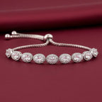 Rhodium adjustable bracelet featuring an oval halo design adorned with zircon stones by Bound Jewels.