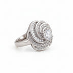 Rhodium luxury spiral baguette zircon ring by Bound Jewels, showcasing a unique design and sparkling gems.
