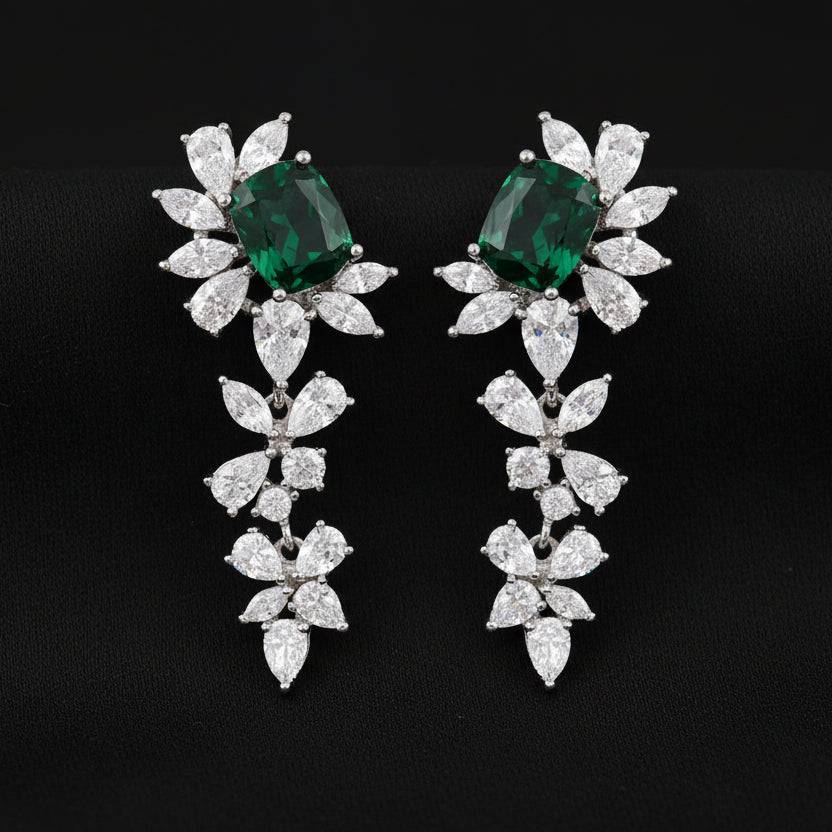 Long drop rhodium zircon earrings by Bound Jewels featuring sparkling stones and elegant design.