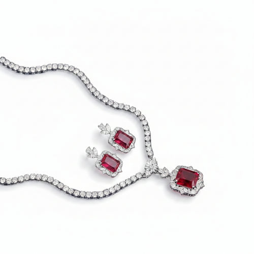 Elegant Bound Jewels zircon necklace and earring set with a rhodium finish, featuring a stunning neckline design.