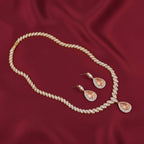 Bound Jewels champagne pear zircon necklace and earring set in rhodium, showcasing elegant design and sparkling stones.
