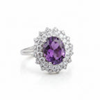 Delicate oval 3A zircon ring in rhodium by Bound Jewels, featuring a shimmering stone set in a polished band.