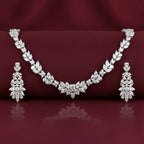 Rhodium necklace and earring set featuring zircon stones, designed by Bound Jewels in an elegant wreath style.