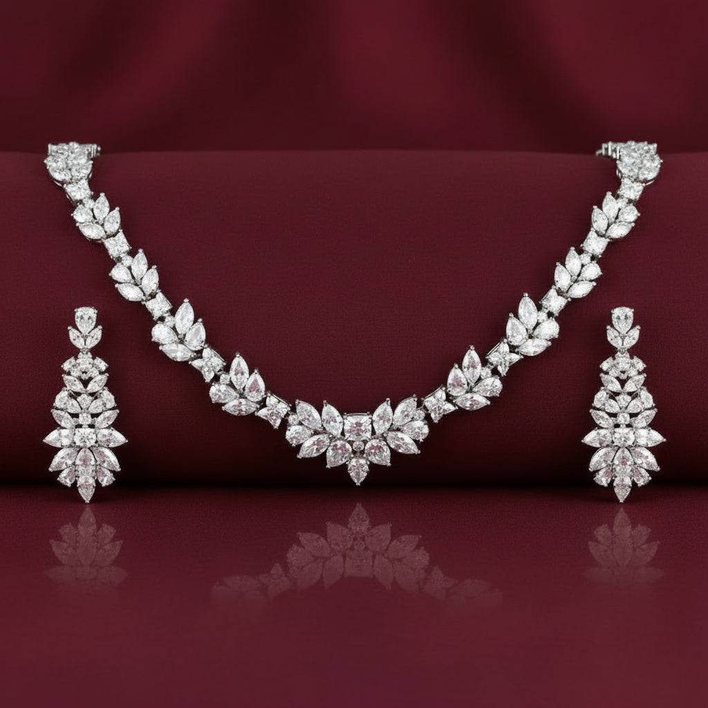 Rhodium necklace and earring set featuring zircon stones, designed by Bound Jewels in an elegant wreath style.