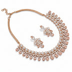 Rhodium floral petal zircon choker and drop earring set by Bound Jewels on a neutral background.