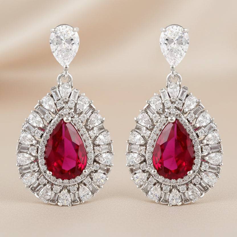 Rhodium drop-shaped earrings featuring luxury zircon stones by Bound Jewels, elegantly designed for a refined look.