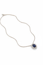 Rhodium-plated Luxora oval zircon pendant by Bound Jewels, showcasing a sparkling gemstone in an elegant design.