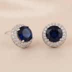 Rhodium-plated Bound Jewels CZ solitaire stud earrings with a sparkling bezel setting.
